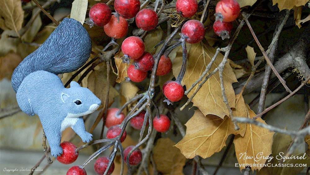 Gray squirrel decoration on autumn wreath.